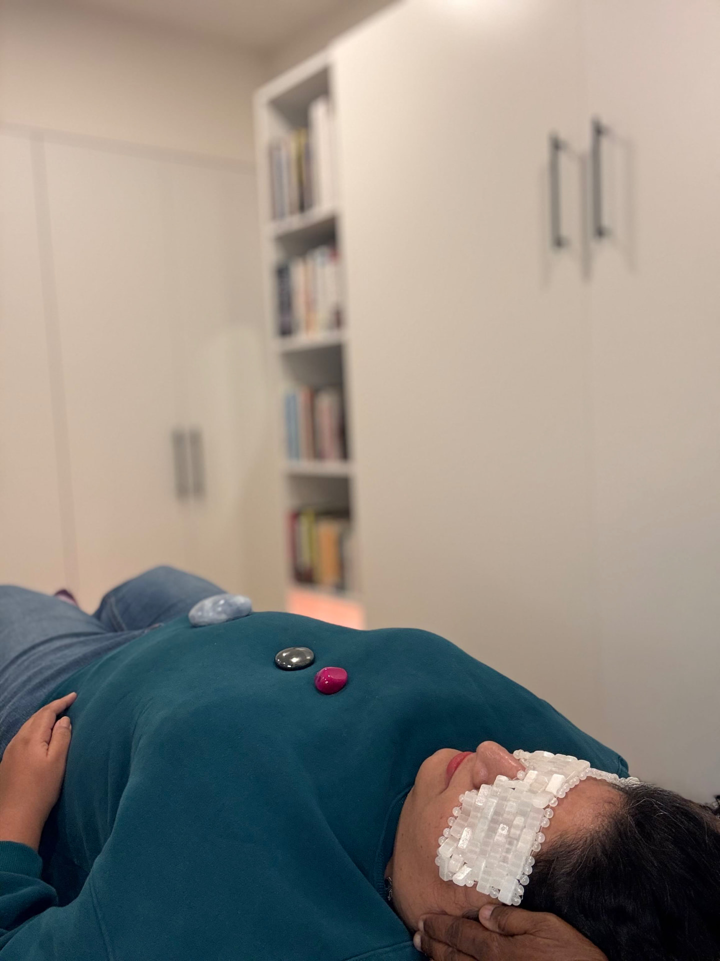 Client resting with crystals during Reiki